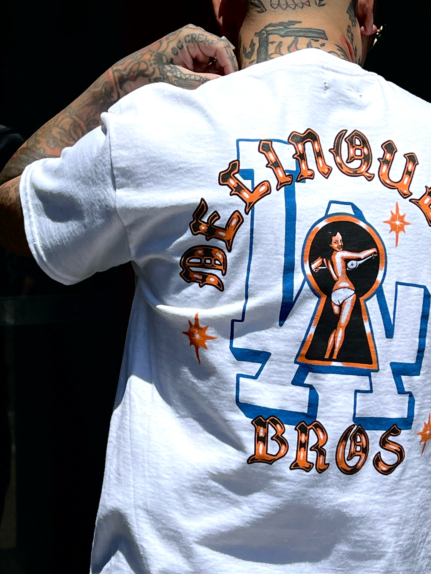 "Peek a Boo" Double sided print Tee in White.