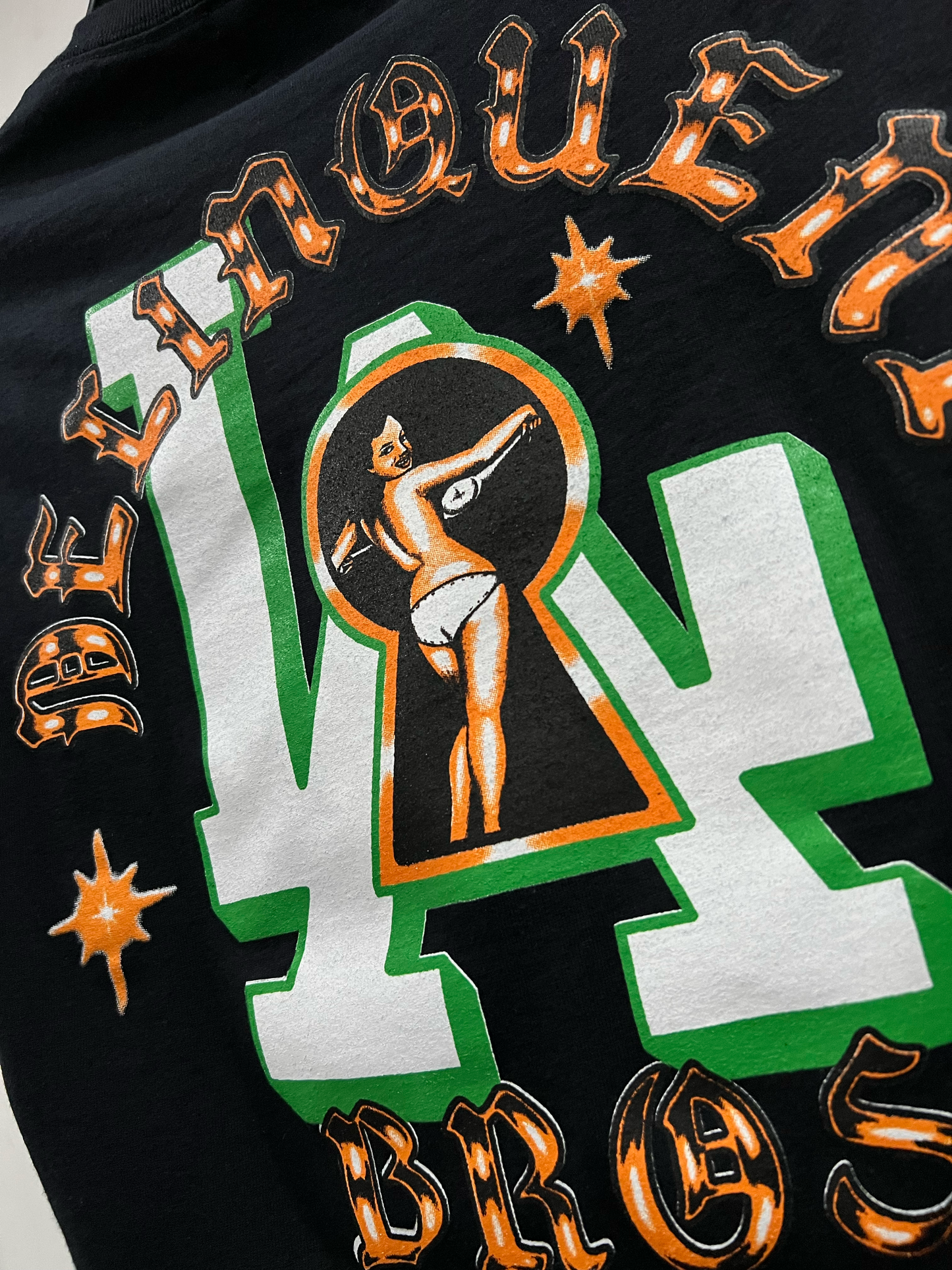 "Peek a Boo" Double sided print Tee in Black.