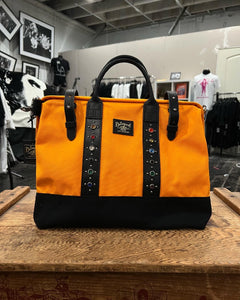 The Delinquent 40s style studded bag in Orange x Black